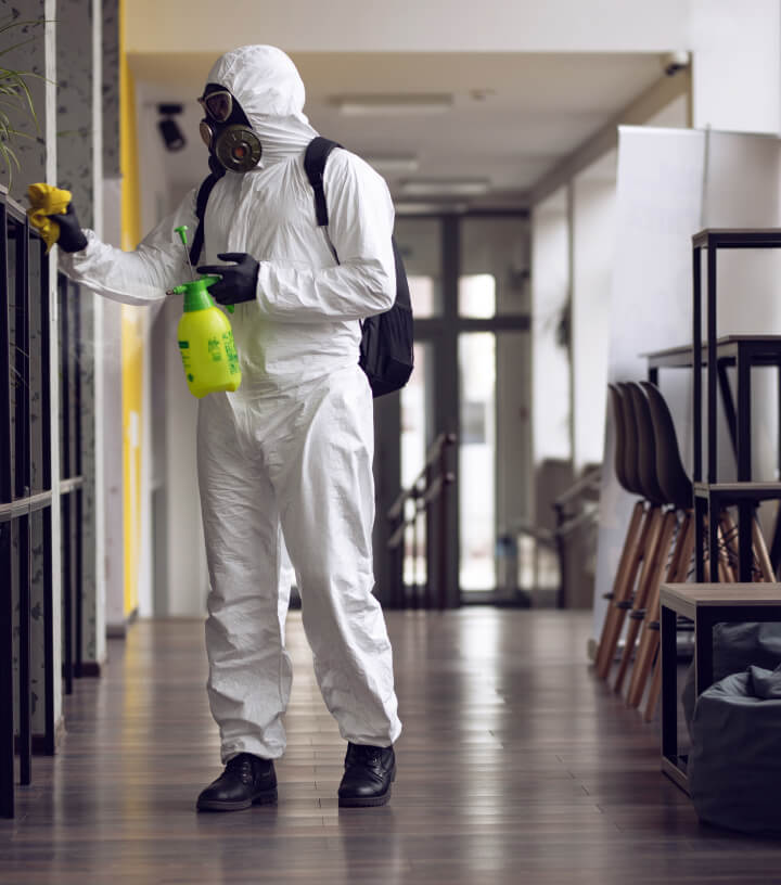a cleaner in a hazmat suit